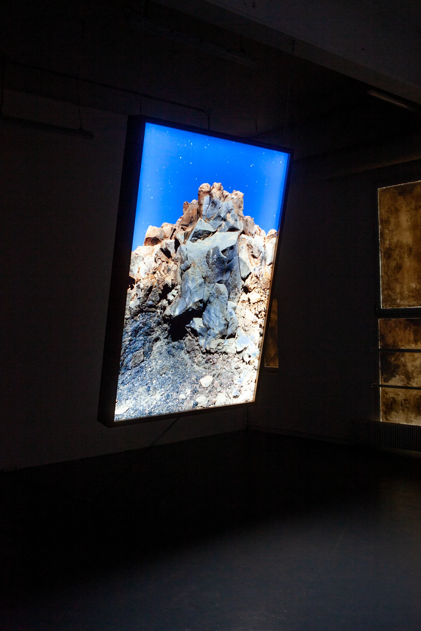 Moonburn, 2020, prints on Plexiglas, LED light box. Installation view.