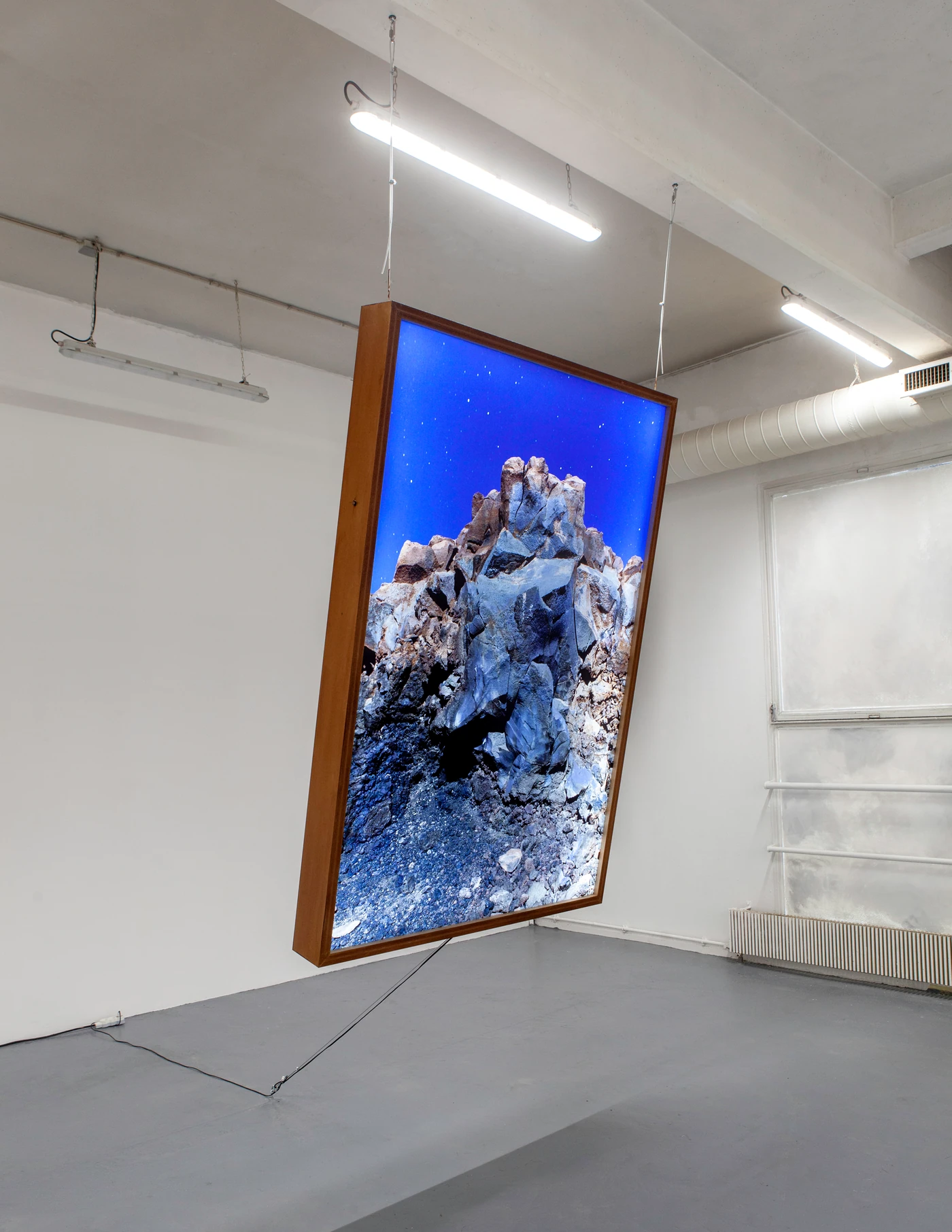 Moonburn, 2020, prints on Plexiglas, LED light box. Installation view.